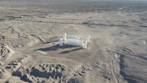 4K Aerial Shot Of  'The Boundless' Installation Art Standing In Desert