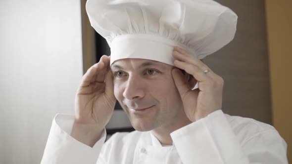 Man Fix the Chef's Hat