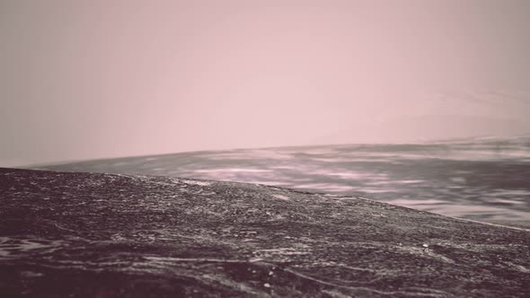 Stones in Snow on Moutain in Summer alt