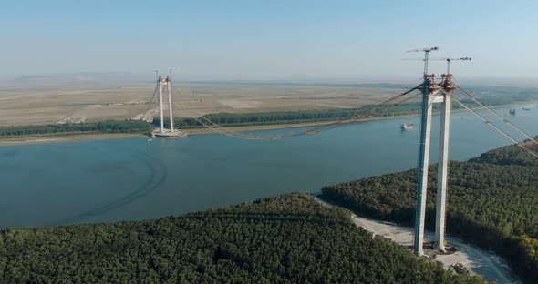 Main Towers Of Braila-Tulcea Bridge Stands On The Riverbanks Of Danube River alt