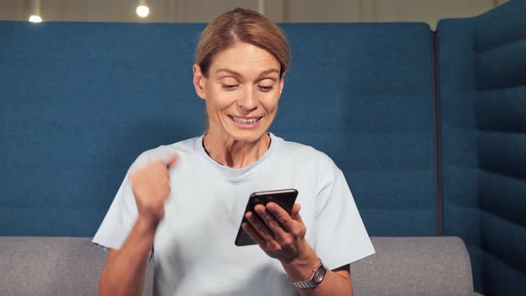 Euphoric Overjoyed Lady Winner Celebrate Mobile Online Bid Game Win Victory alt