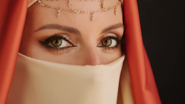 Close Up Portrait Of Beauty Young Muslim Woman In Hijab Looking At Camera.