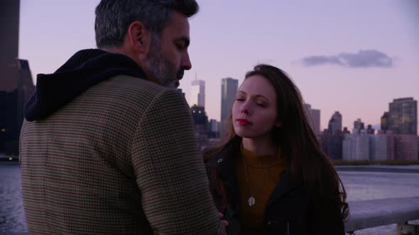 Couple in New York City with city skyline in background