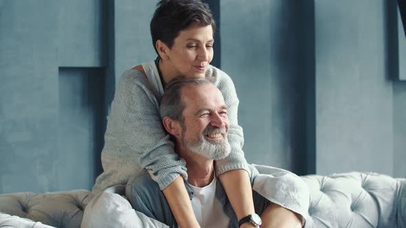 Aged Couple Sitting on the Couch alt