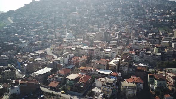 Drone view on poverty slum district and muslim mosque