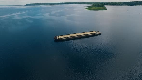 Abandoned Barge with Sand on River alt