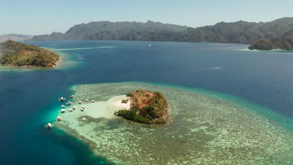 Small Torpical Island with White Sandy Beach, Top View. alt