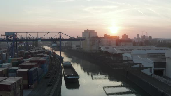 Port Warehouses and Cargo Loading Cranes in Beautiful Morning Sunlight, Aerial Forward Crane Up Slow alt