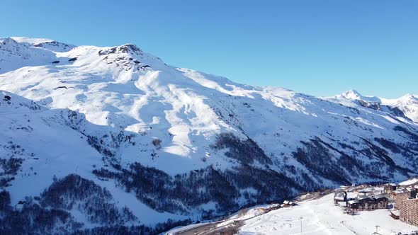 Aerial View of the Alps Mountains in France. Mountain Tops Covered in Snow. Alpine Ski Facilities