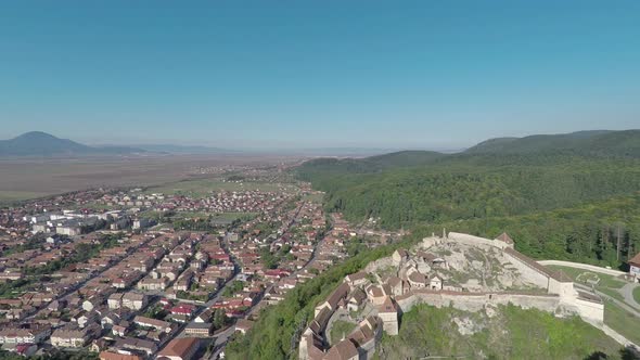 Aerial of Rasnov town and fortress alt