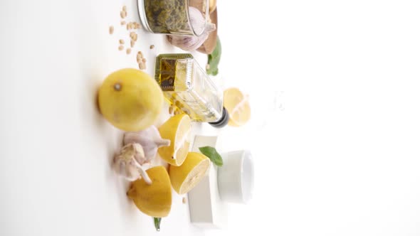 Vertical video: Olive oil with ingredients alt