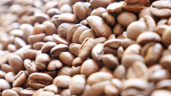 Roasted coffee beans  ready to be grinded slow  panning shallow DOF 4K 2160p UltraHD footage - Backg alt