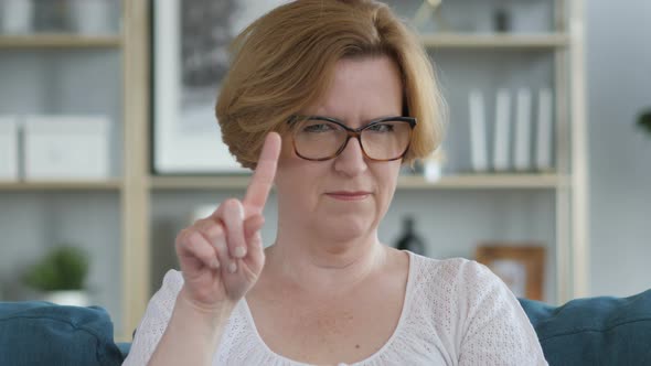 No, Old Woman Rejecting Offer by Waving Finger alt