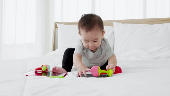 happy family cute baby play toy on bed. kindergarten preschool education