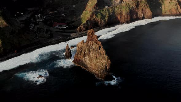 Drone Flying Towards Massive Sea Stack Near Ribeira Da Janela, Madeira Island Portugal
