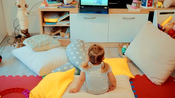 Girl Watching Cartoon. Kids Leisure And Entertainment. Cute Children Watching Fairy Tale Story. alt