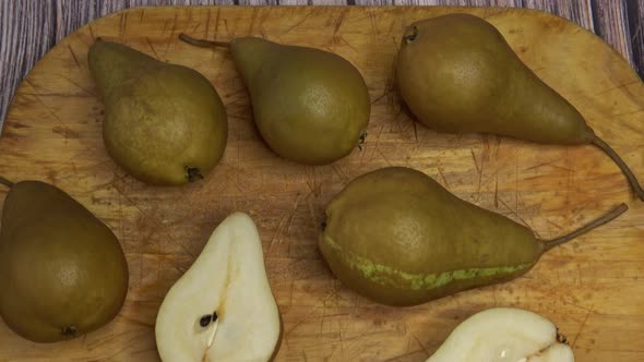 Wooden board with sweet ripe pears.