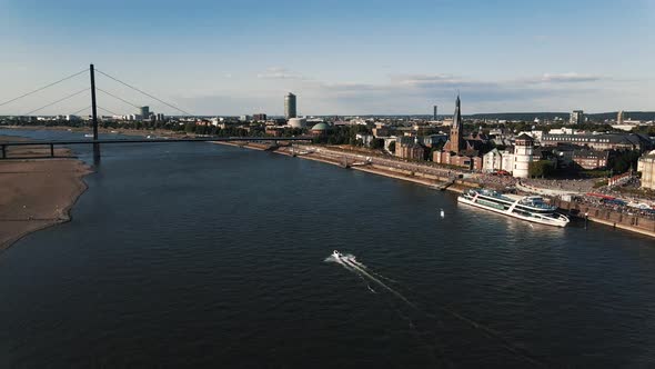 Sunny Day And Crowd At Rhine and Aerial View of the City of Dusseldorf in Germany 