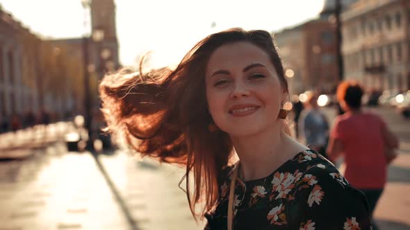 Sexy Girl with Long Red Hair Turning Around and Smiling on Camera Outdoor alt