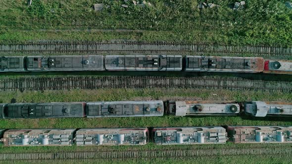 Aerial Top Down Shot of an Abandoned Rusty Locomotives and Old Railways alt