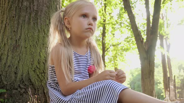 Girl under a tree in the park