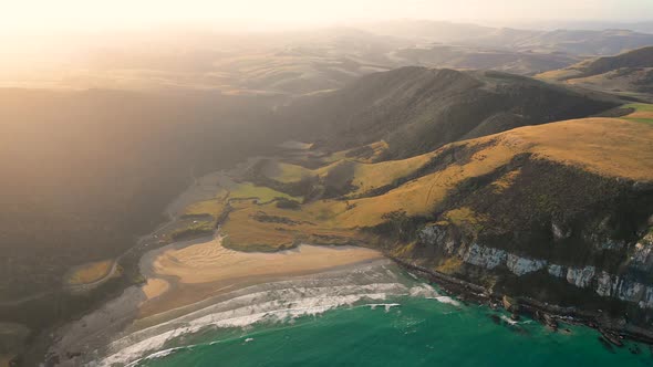 Aerial view of scenic sunset over Purakaunui Bay, New Zealand. alt