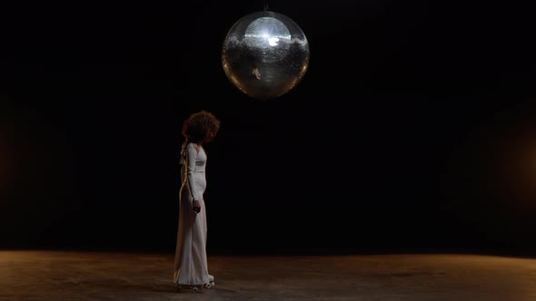 Charming African American Woman Wearing Roller Skates Rides on the Stage alt