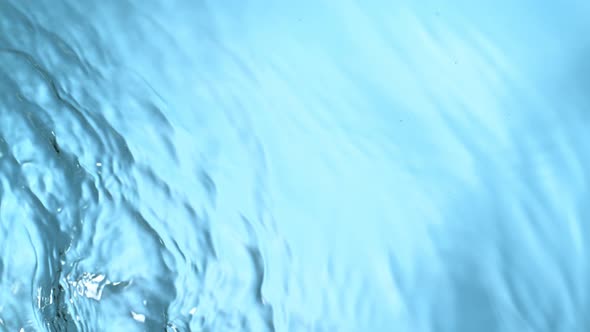 Super Slow Motion Abstract Shot of Rippling Blue Water Background at 1000Fps. alt