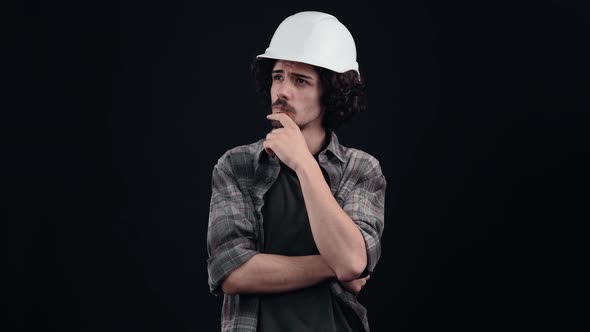 Smart Hipster with Curly Hair Thinking About the Consequences of Some Problems alt