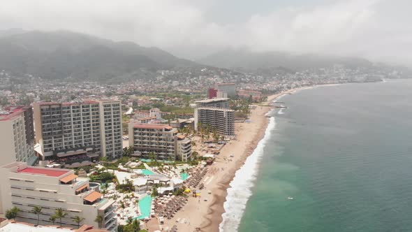 Aerial drone footage of the beautiful beach and coastal area of Puerto Vallarta in Mexico