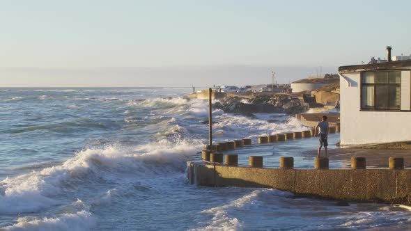 Ocean Wave Floods Into the Storm a House on the Shore alt