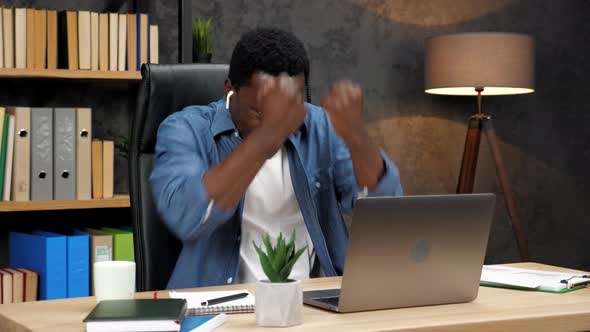 Excited African American Man Winner Looks at Laptop Celebrates Online Success alt