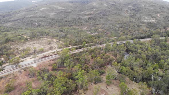 Aerial View of a Train Line in a Forest in Australia