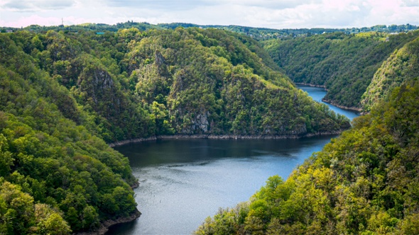 Saint Nazaire Belvedere, with sun light on the water and tree. Correze, France