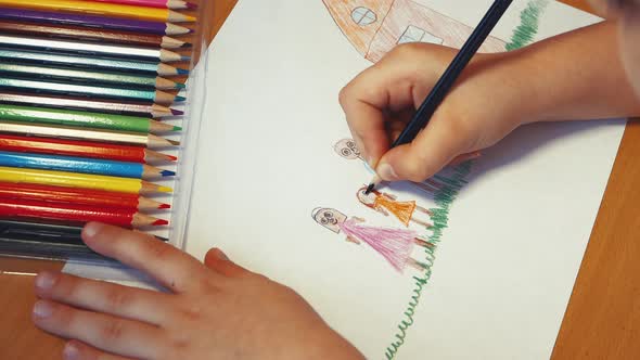 Children's Hands are Turning the Girl Next to Mom and Dad Next to the House alt