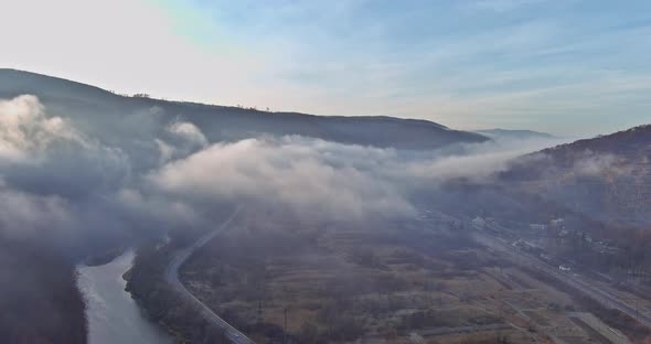 Beautiful Panorama of Aerial View on Autumn Forested Mountain Slope with Morning Fog alt