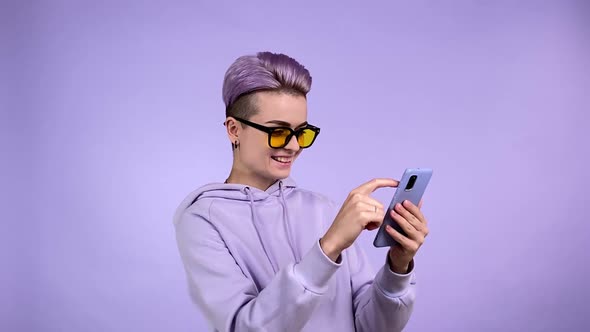 Young Woman Surprising to Find Funny Memo Laughing Using Smartphone alt
