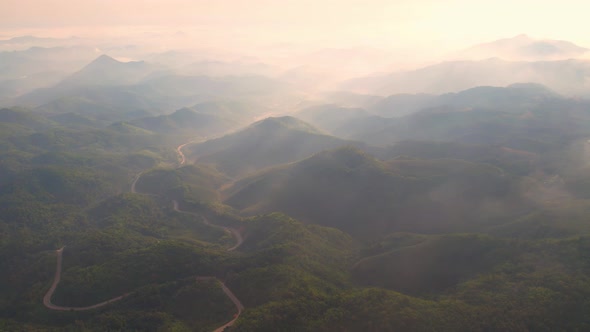 4K Drone Flying in the clouds. Flying through the clouds during sunrise alt
