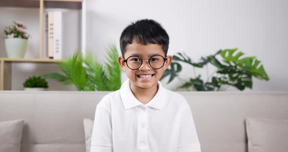 Slow motion Boy smile and look at camera. alt