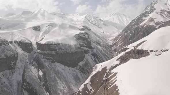 Gudauri, Georgia - April 12, 2021: Aerial view of Russia–Georgia Friendship Monument alt