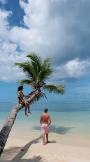 Anse Takamaka Beach Mahe Seychelles Tropical Beach with Palm Trees and a Blue Ocean Couple Man and alt