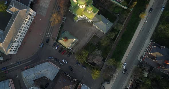 Aerial View Streets of Kyiv on Which Cars Drive at Beautiful Sunset or Sunrise alt