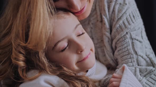 Mother and Daughter Cuddle Carefree alt