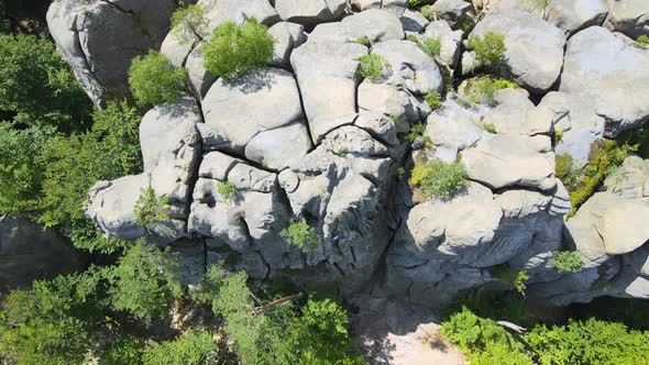 Determined Boy Climber Clambering Up Steep Wall of Rocky Mountain alt