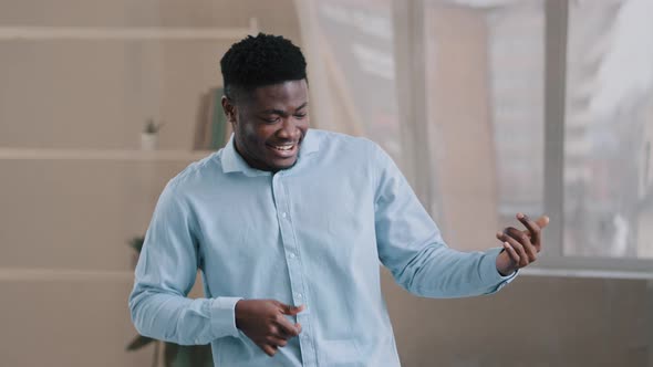 Happy Millennial African American Businessman Male Employee Relaxing at Home Office Listening Music alt