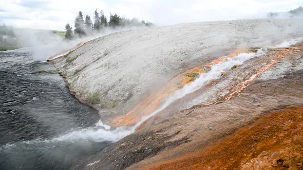 Outlet of the Excelsior Geyser in the Firehole River with Mineral Deposits Midway Geyser Basin alt