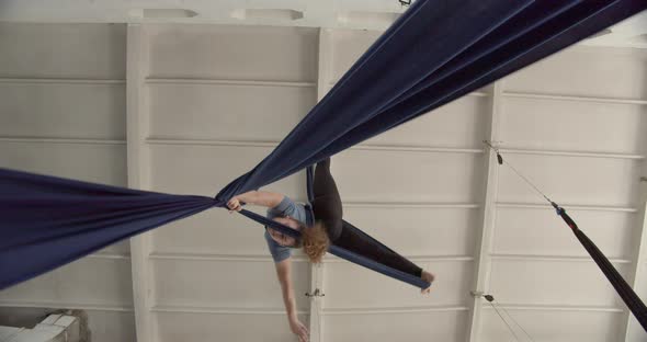 Aerial Silks Training in the Gym Low Angle View of a Woman Doing Gymnastics alt