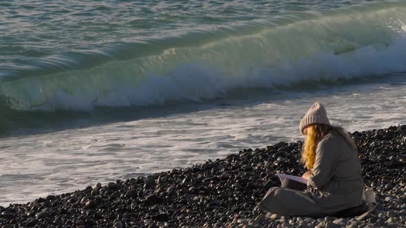 A Girl Reading a Book By the Sea alt