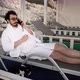 Man is Resting on Sunbed When Somebody Call Him on Smartphone and Say Bad News - VideoHive Item for Sale
