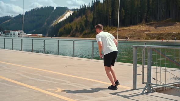 Young man running fast and intense in forest alt